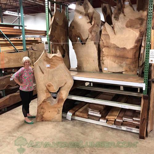 Who cuts salvaged Banyan trees into table slabs?